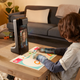 A photo of a kid sitting at a desk and talking to someone over the Amazon Glow